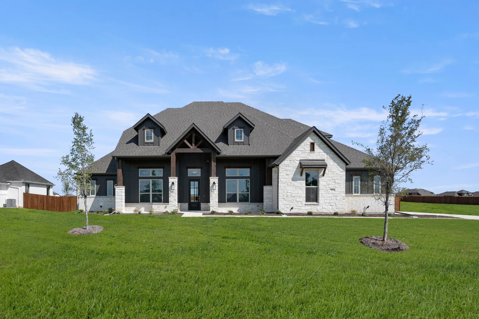 Exterior of a modern Texas ranch style home by Kindred Homes