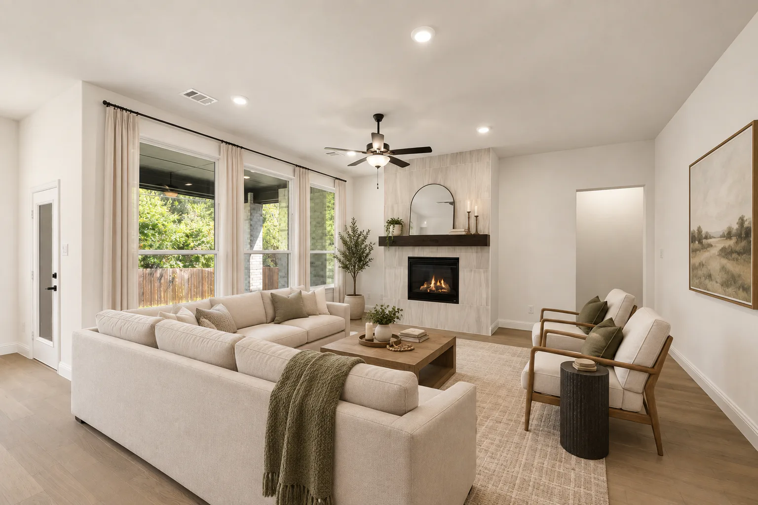 Virtually staged living room in a new traditional style home by Kindred Homes
