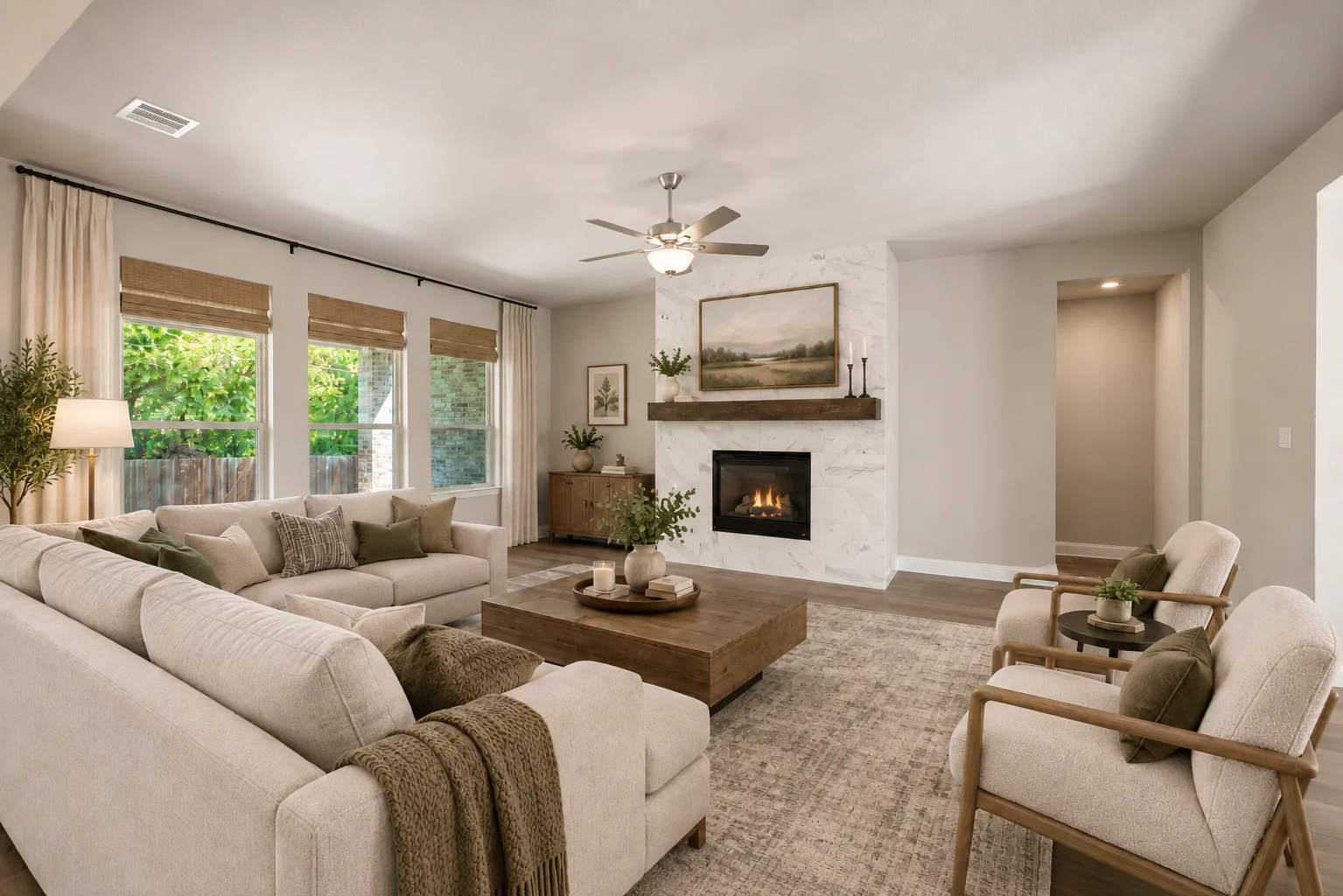 Virtually staged living room in a transitional ranch style home by Kindred Homes