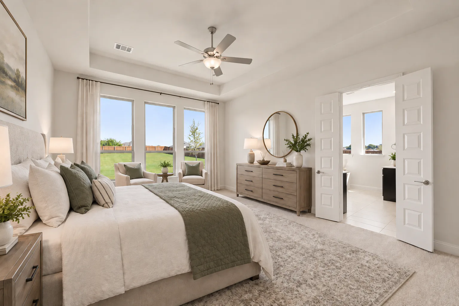 Virtually staged primary bedroom in a modern Texas ranch style home by Kindred Homes
