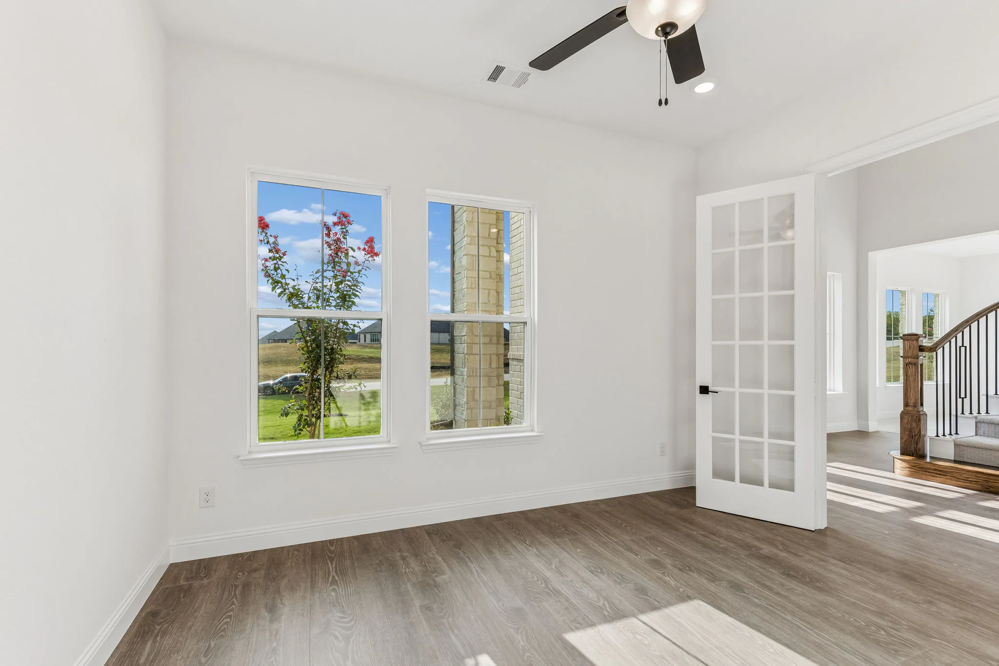 Study in a transitional hill country style home by Kindred Homes.