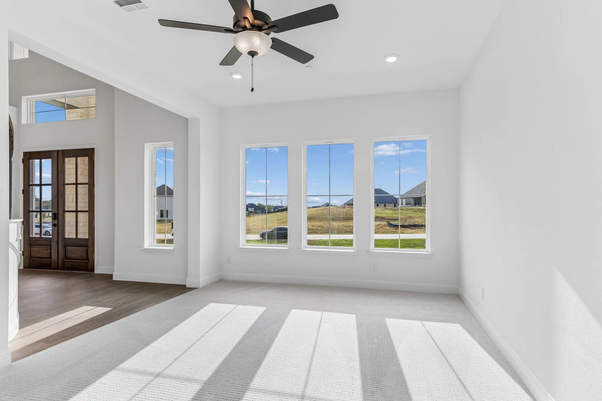 Dining room in a transitional hill country style home by Kindred Homes.
