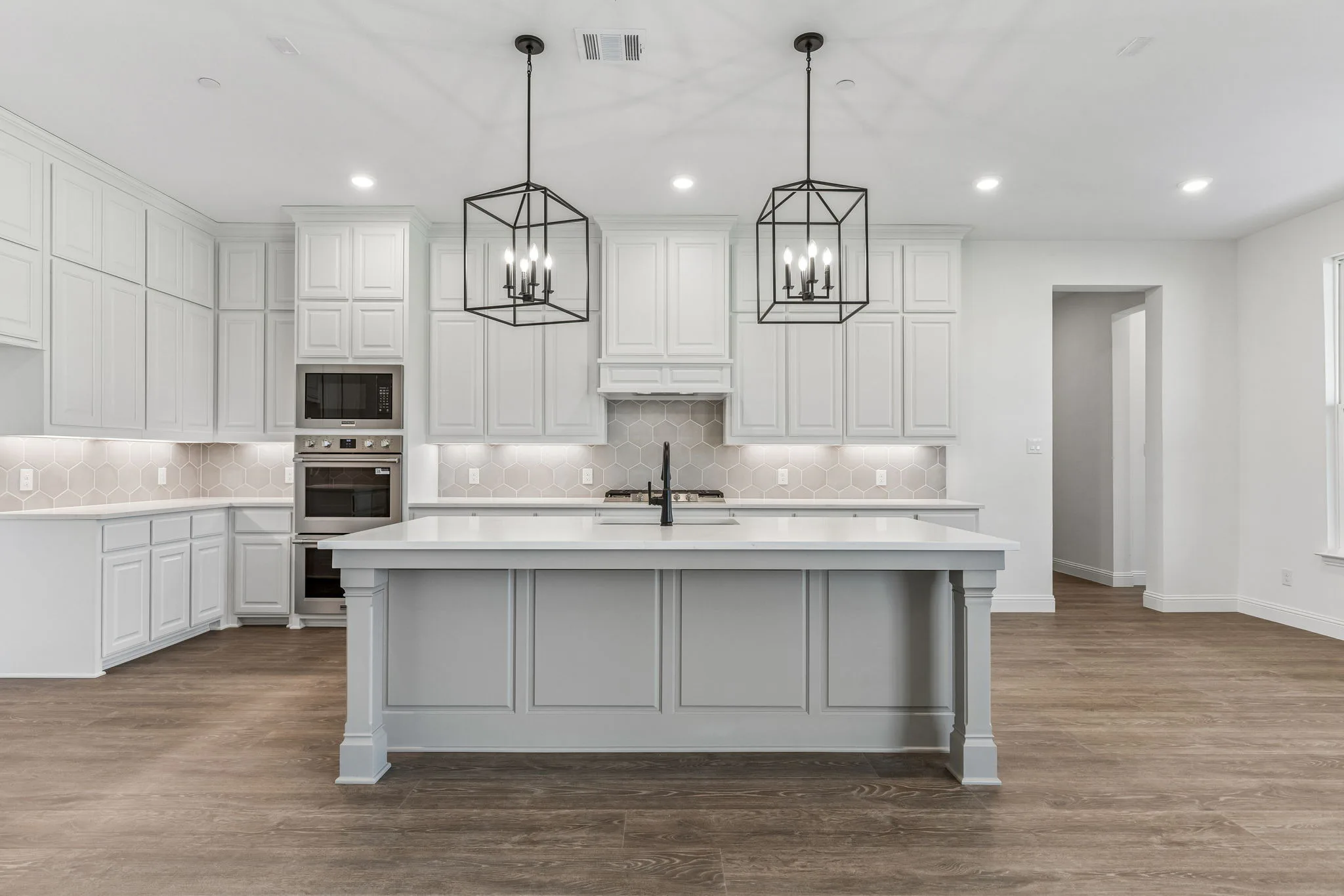 Kitchen in a transitional hill country style home by Kindred Homes.