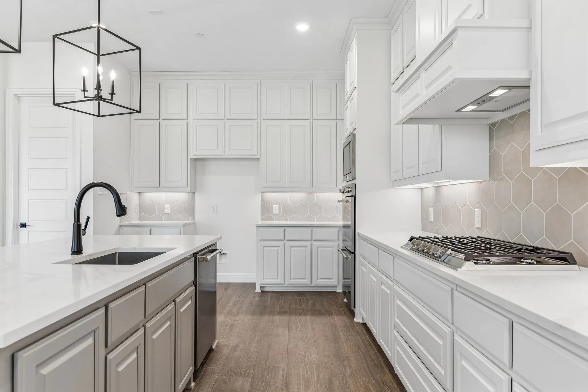 Kitchen in a transitional hill country style home by Kindred Homes.