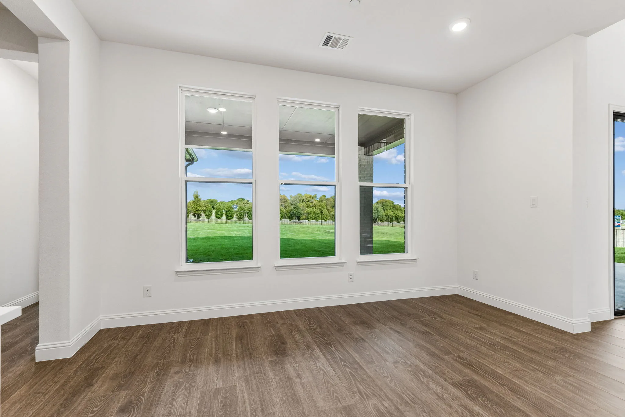 Breakfast nook in a transitional hill country style home by Kindred Homes.