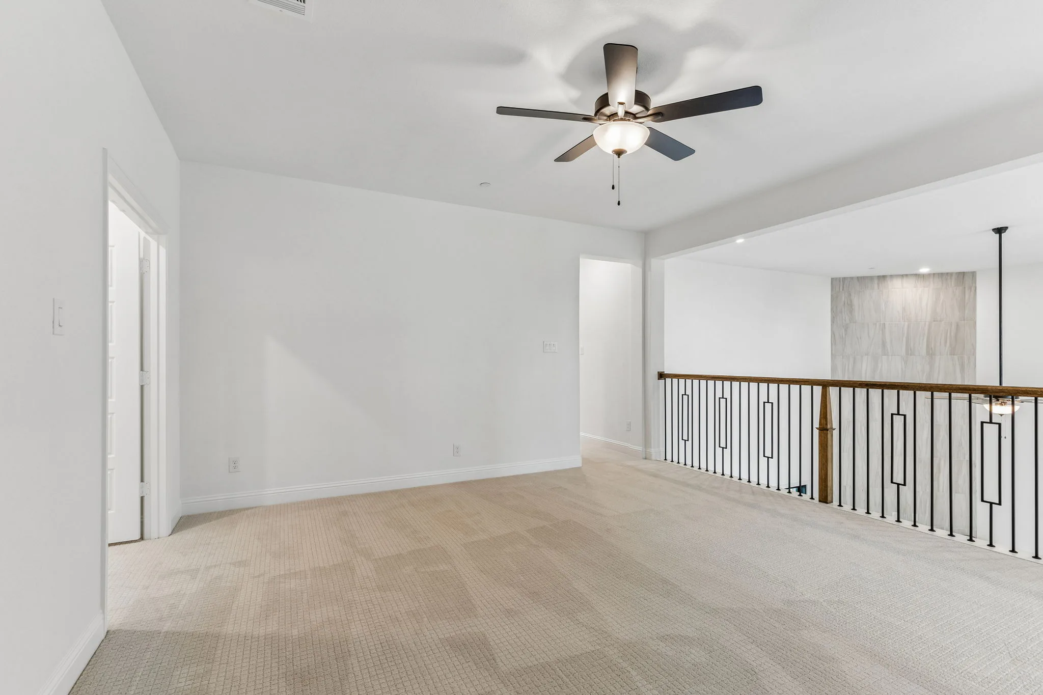 Game room in a transitional hill country style home by Kindred Homes.