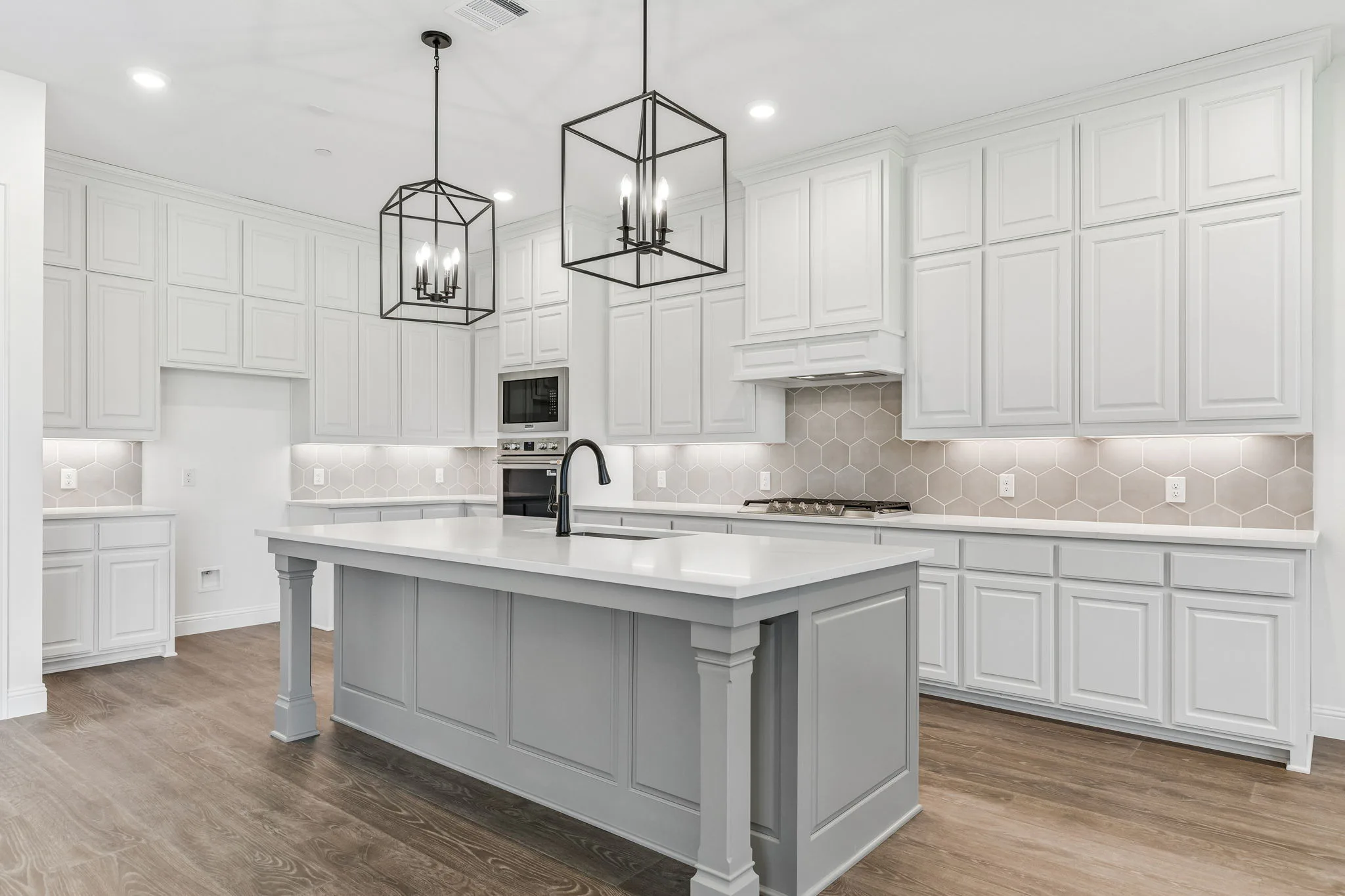 Side view of kitchen in a transitional hill country style home by Kindred Homes.