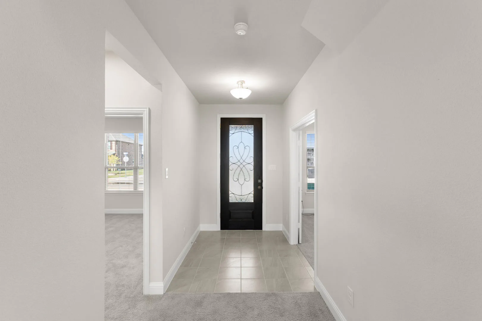 Entryway of a new traditional style home by Kindred Homes