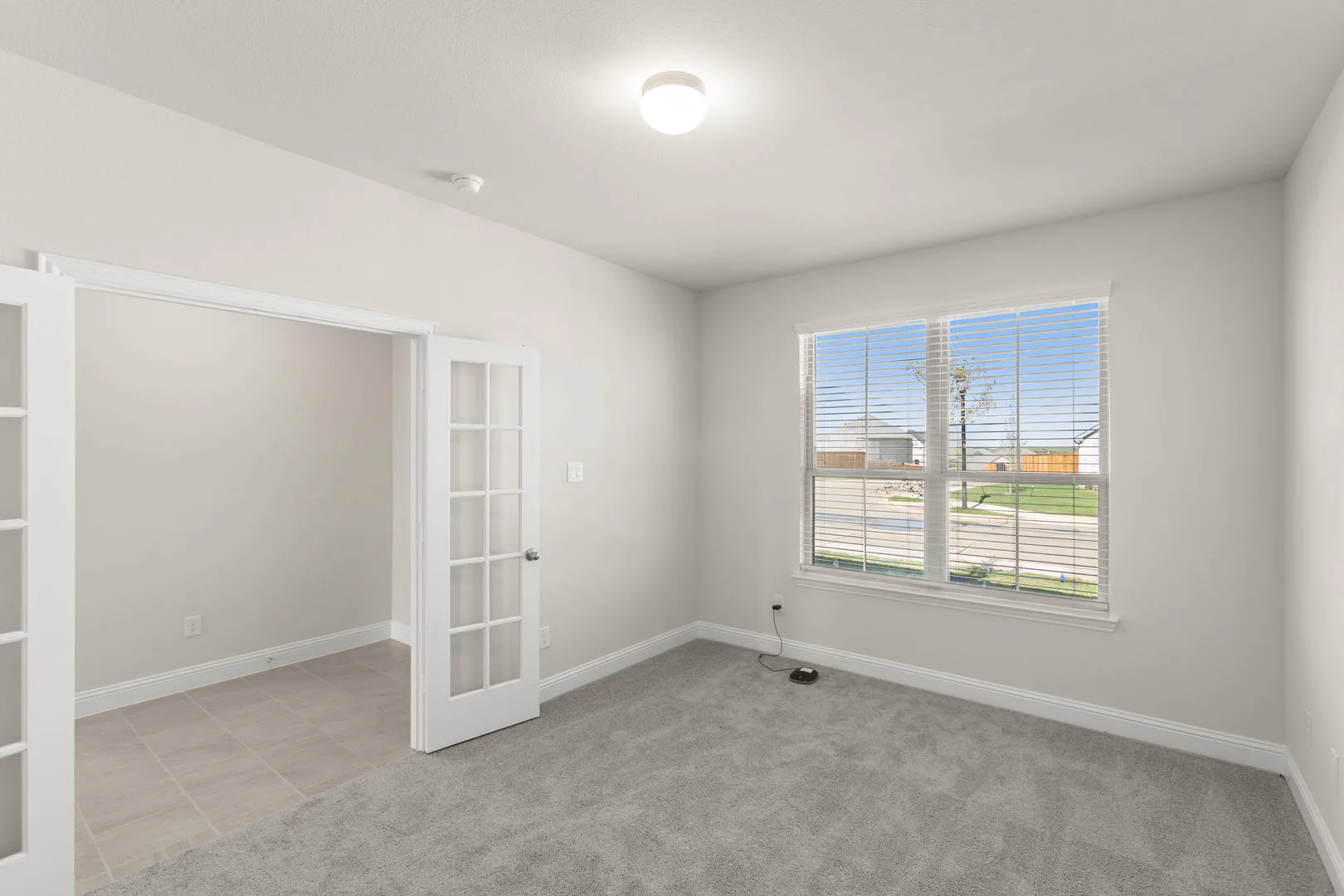 Study in a new traditional style home by Kindred Homes