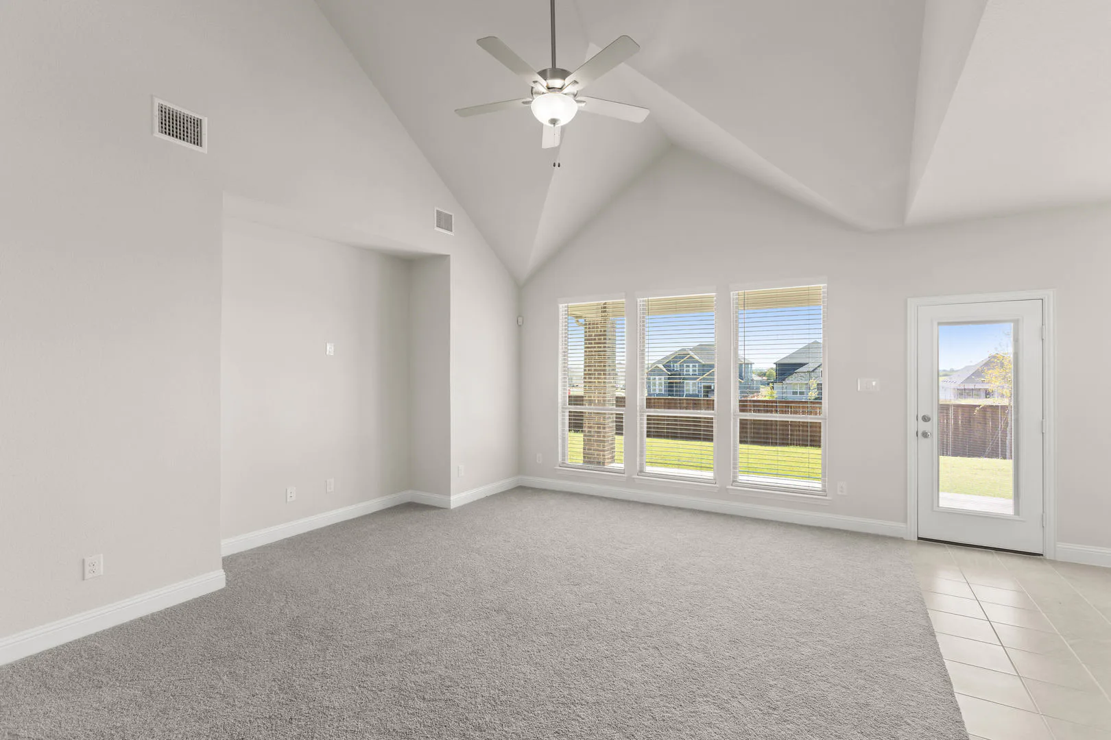 Living room in a new traditional style home by Kindred Homes