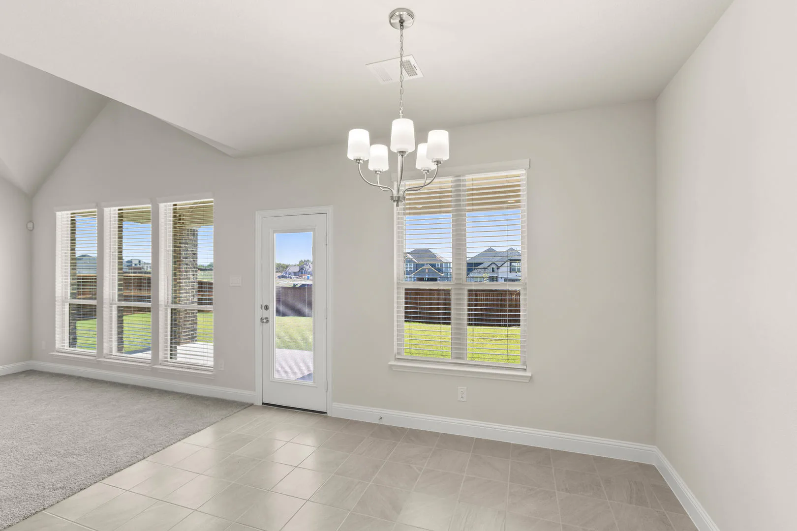 Breakfast nook in a new traditional style home by Kindred Homes