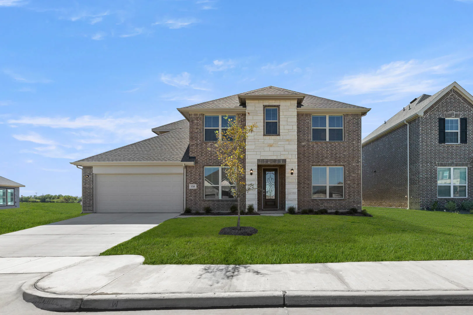 Exterior of a new traditional style home by Kindred Homes