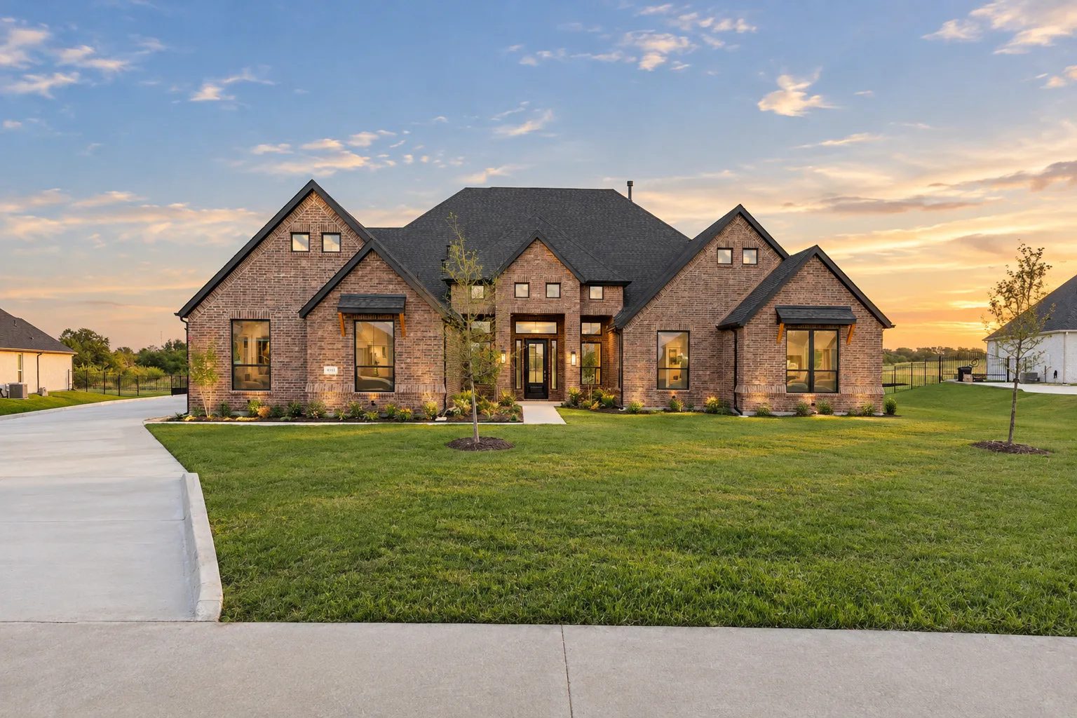 Front exterior of a transitional ranch style home by Kindred Homes